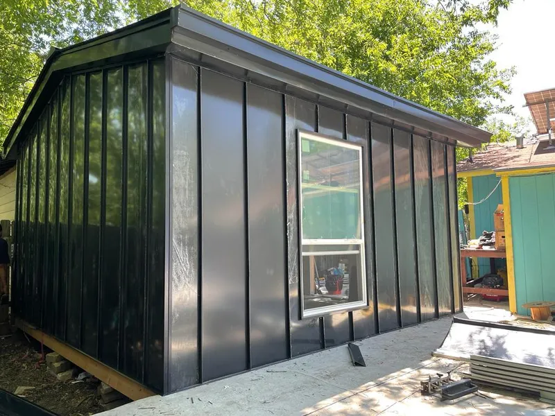 Black standing seam metal wall panels for Roof Inspection in Swansea