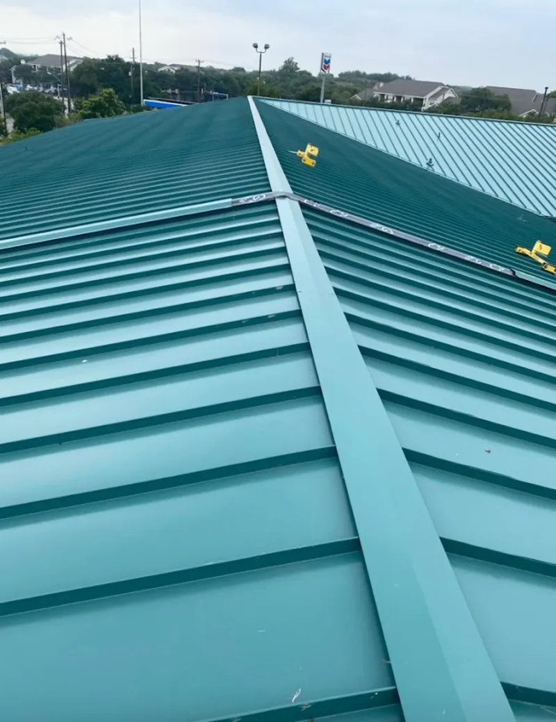 Green commercial metal roof ridge and valley for Metal Roof Repair in Swansea